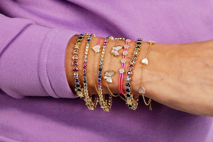 Pulsera de tenis con corazón y bisel de arcoíris